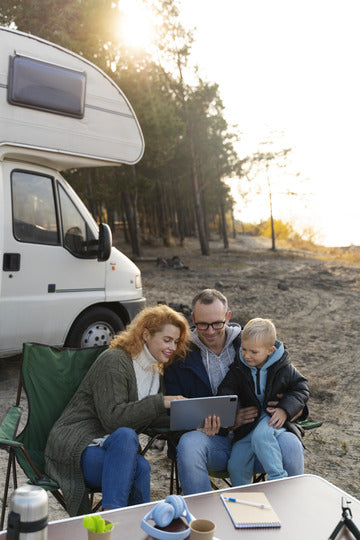 Happy family living a digital nomad lifestyle with their motorhome